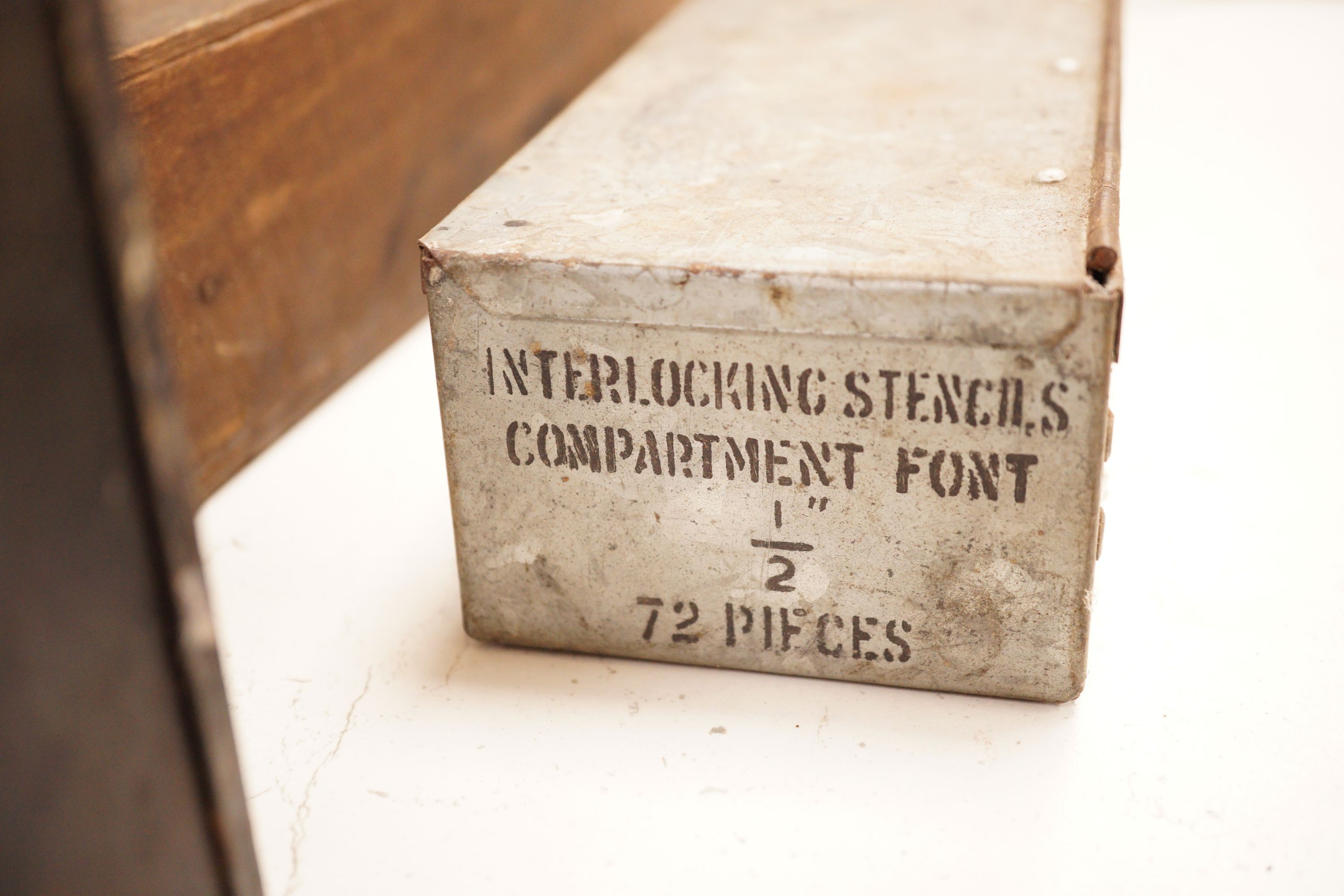 A mixed collection of early 20th century brass and other alphabetical stencil plates, varying sizes